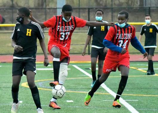 Musa, #37, is pictured kicking a soccer ball.