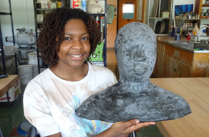 Student holding Ceramic Piece