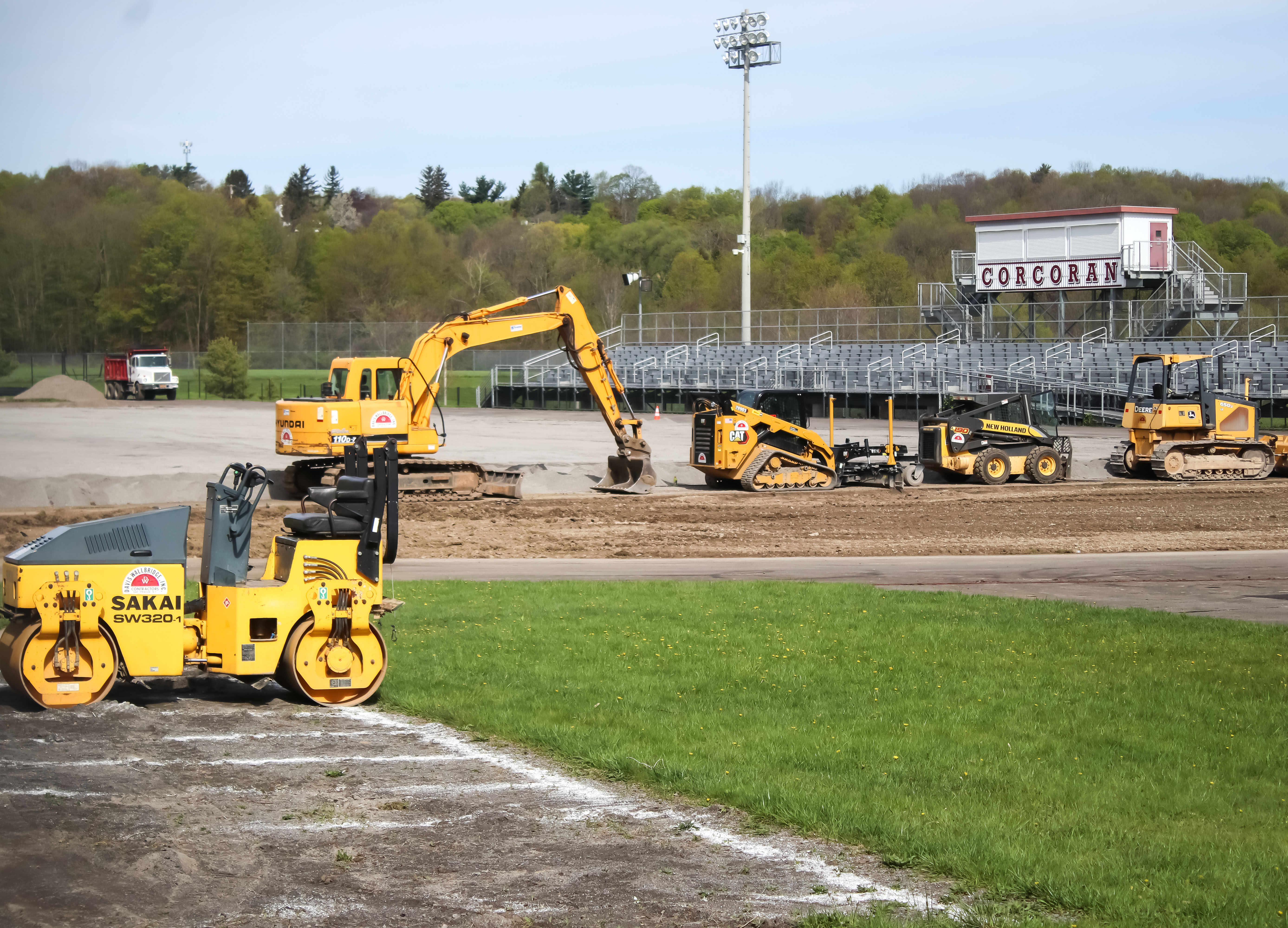 Construction vehicles at stadium.
